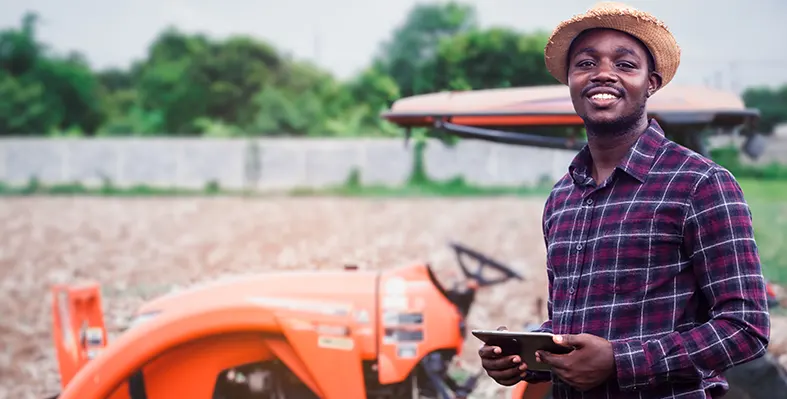 AfDB's investments drive sustainable farming, improve productivity, and strengthen food security in Africa Farmer_using_agtech