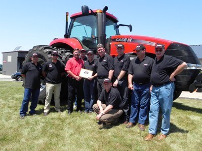 Messrs_Pieter_Van_Zyl-_PG_Van_Zyl_and_Dirk_Fourie_with_their_staff-_Case_IH_and_Northmec_management_at_the_Case_IH_manufacturing_plant_b_