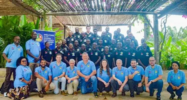 The attendees of the training week gathered for a group picture.