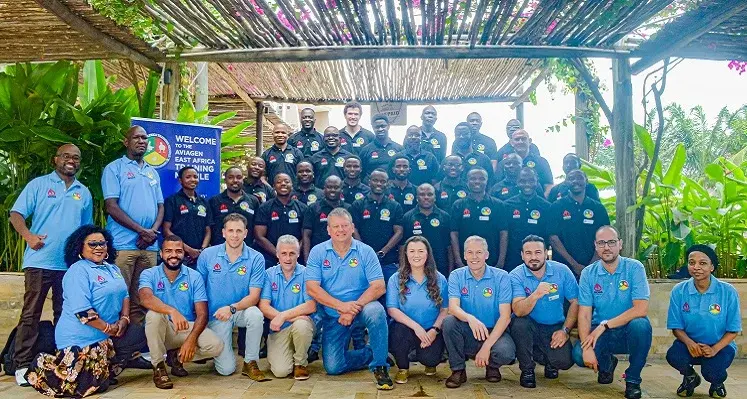 The attendees of the training week gathered for a group picture.